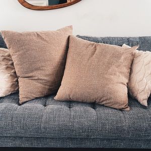 Two ~22"x22" throw pillows -- sand / tan / natural linen with inserts